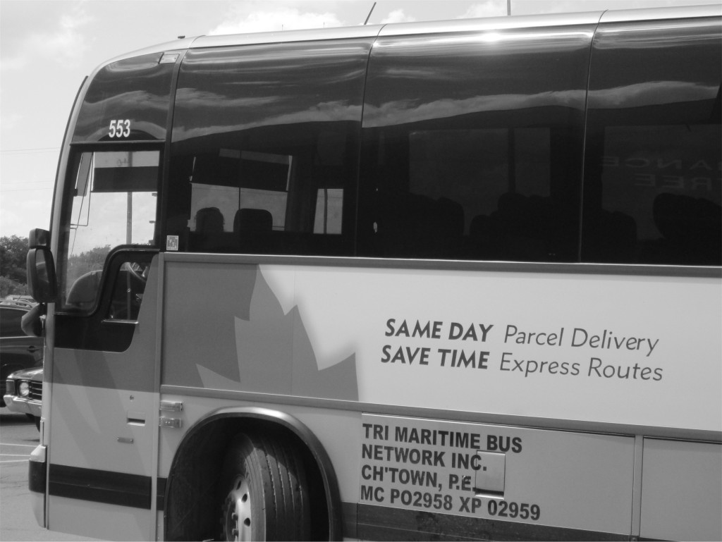 Maritime Bus coach bearing the promise "SAME DAY parcel delivery / SAVE TIME express routes"
