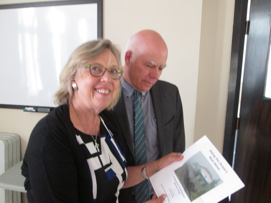 Federal Green Party leader and MP Elizabeth May and New Brunswick Green Party leader and MLA David Coon hold a copy of Greg Gormick's new report on the future of VIA's Ocean